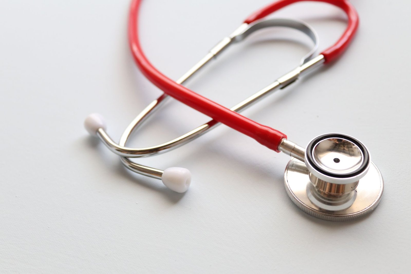 Close-up of a red stethoscope symbolizing medical care and healthcare diagnostics. — CBD in the Beauty Industry: Routine Addi