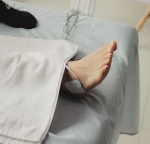 A close-up image of a bare foot with a medical electrode, suggesting a healthcare setting. — Choosing a Gym in Spring TX