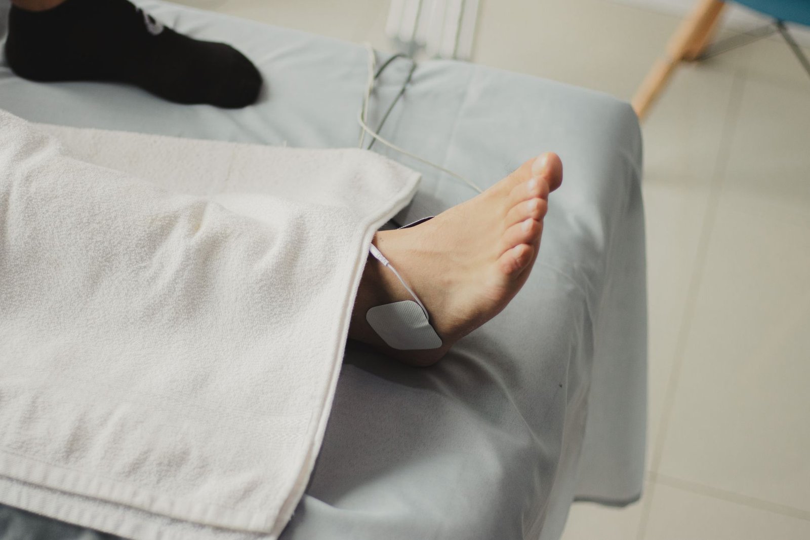 A close-up image of a bare foot with a medical electrode, suggesting a healthcare setting. — Choosing a Gym in Spring TX