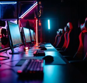 An immersive gaming room with neon lights, computers, and gaming chairs ready for a tournament. — How a Playground Site Ensur