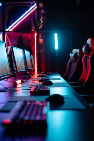 An immersive gaming room with neon lights, computers, and gaming chairs ready for a tournament. — How a Playground Site Ensur
