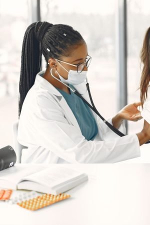 A female doctor gives a health check-up to a child in a bright clinic. — Rolling Hills Recovery Center: Empowering You to Liv