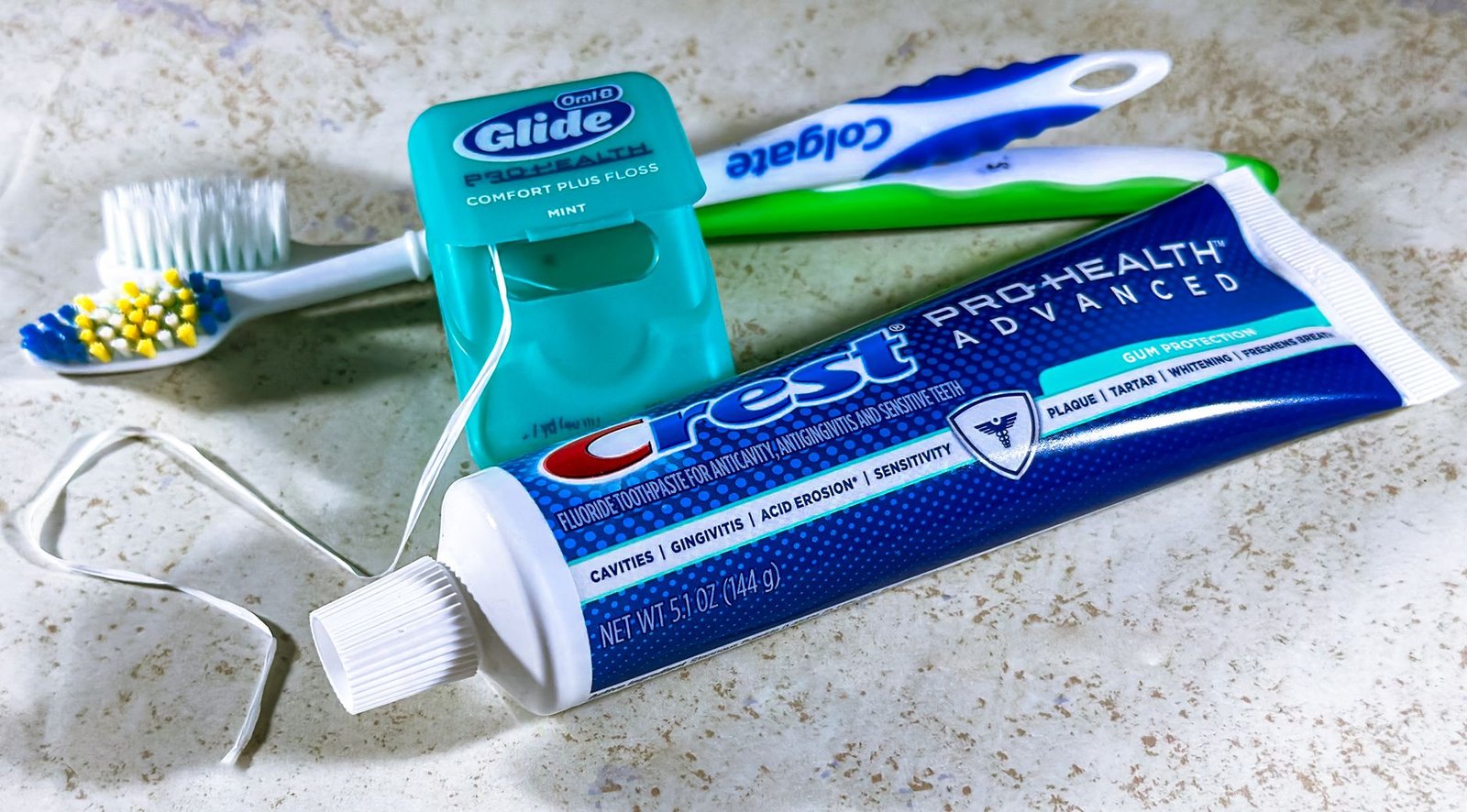 Close-up of dental care items including toothbrush, floss, and toothpaste for oral hygiene. — Sleeping Supplements: Choose th