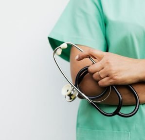 Close-up of a healthcare worker holding a stethoscope, showcasing medical professionalism. — Take care of your teeth in the r