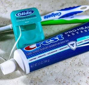 Close-up of dental care items including toothbrush, floss, and toothpaste for oral hygiene. — Understand Your Deals with the