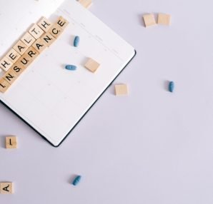 Flat lay of health insurance concept with planner and pills. — Why You Need Colonic Irrigation